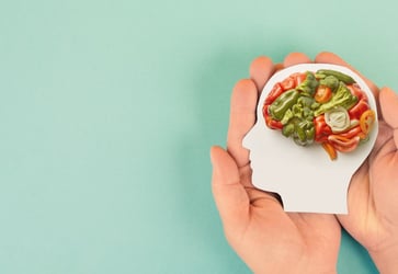 Hands holding mood-boosting foods