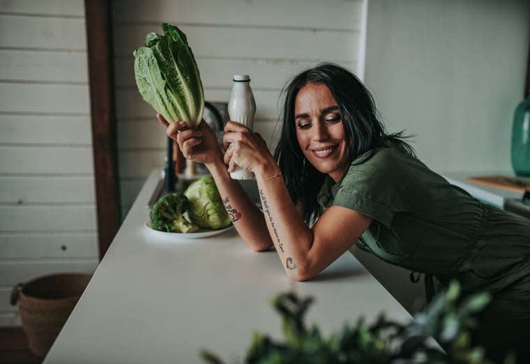 healthy women with vegetables in hand