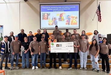 Project FoodBox volunteered to pack produce at the Second Harvest Food Bank's distribution center this year, adding a cash donation to the effort.