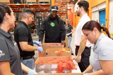 Wide receiver Davante Adams helps sort produce at a local food bank in Las Vegas